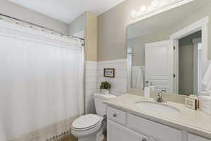 Full bath featuring vanity and a shower with curtain