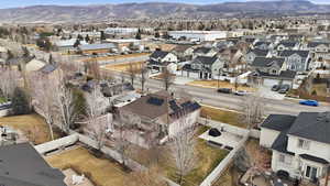 Aerial perspective of suburban area with a mountain backdrop