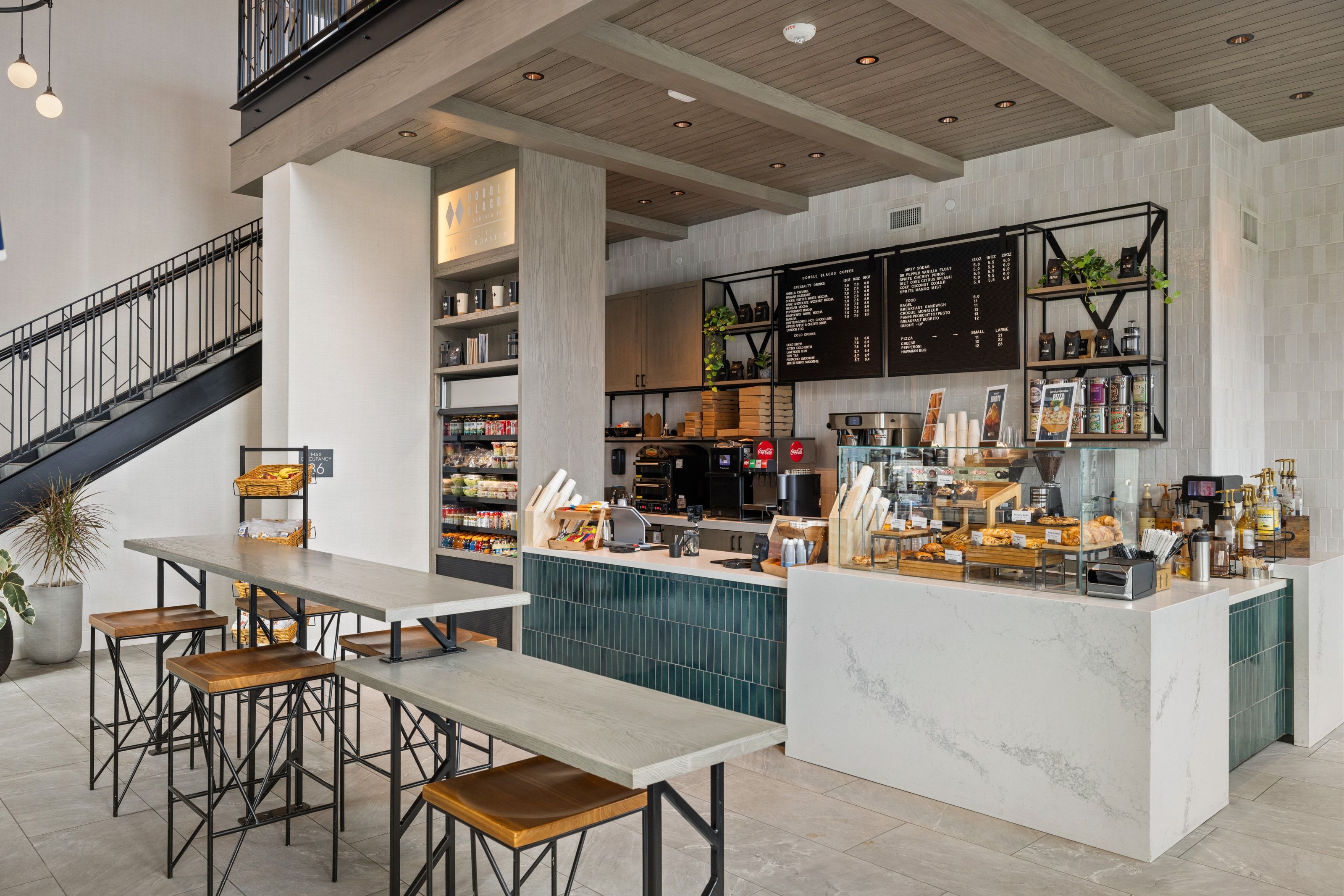 Bar with a wood ceiling with exposed beams and open shelves