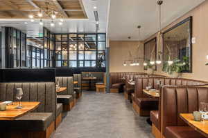 Community lobby with beam ceiling and recessed lighting