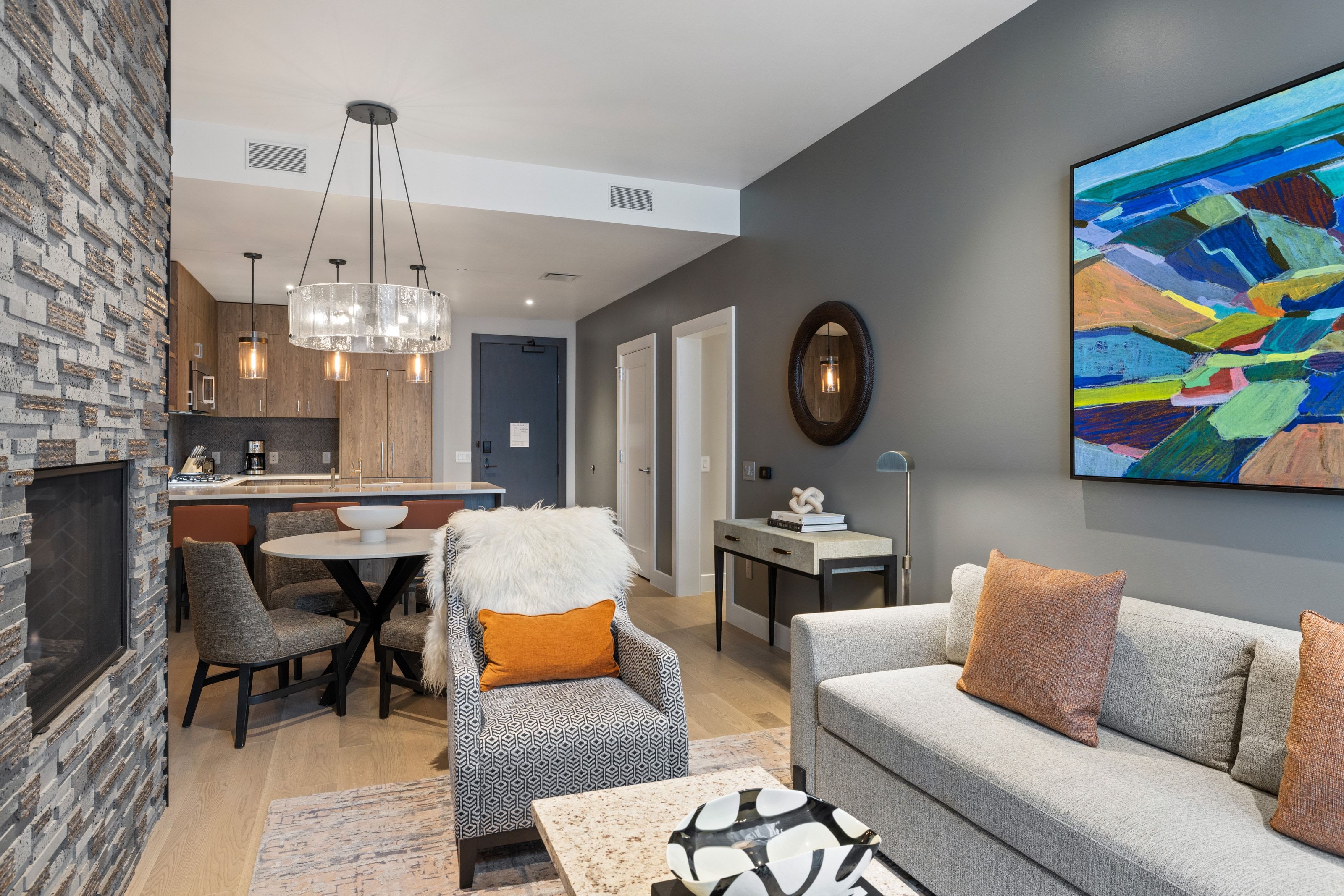 Living area with light wood-style floors and a fireplace