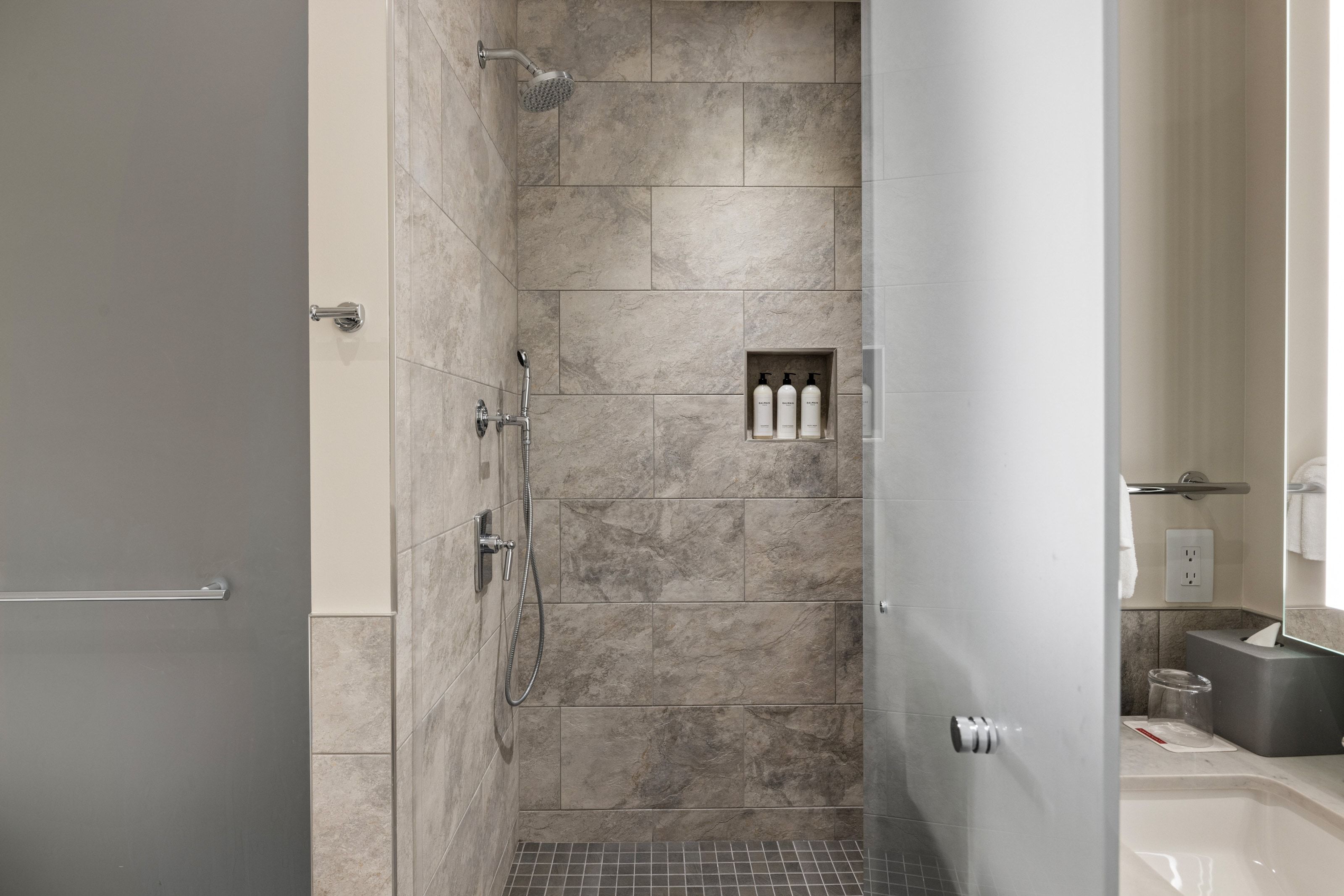 Full bath featuring a stall shower and vanity