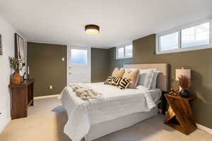 Carpeted bedroom with baseboards