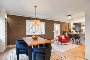 Dining room featuring ornamental molding and baseboards