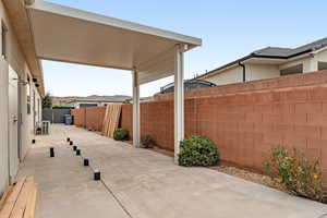 Fenced backyard featuring a patio area