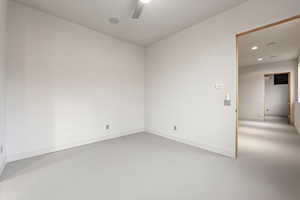Spare room with concrete floors, recessed lighting, and a ceiling fan