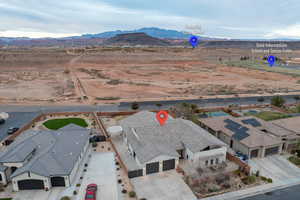 Aerial perspective of suburban area featuring a mountainous background