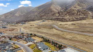 Aerial perspective of suburban area with a mountainous background