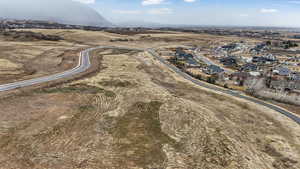 View of property location featuring a mountainous background and nearby suburban area