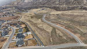 View of property location featuring nearby suburban area and a mountainous background