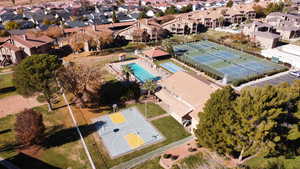 Aerial view of property's location featuring nearby suburban area and a pool