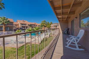 Balcony with view of pool area