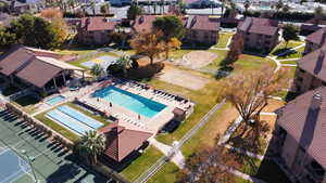 Aerial view of residential area featuring a pool area