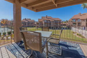 View of patio with outdoor dining area and a residential view