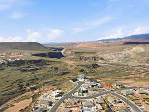 Aerial perspective of suburban area featuring a mountain backdrop