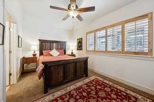 Bedroom featuring ceiling fan and carpet floors