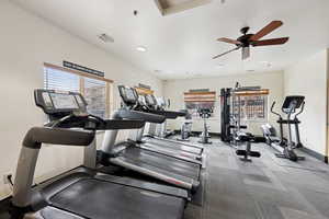 Workout area with ceiling fan and recessed lighting