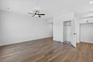 Unfurnished bedroom with dark wood-style flooring, recessed lighting, and a ceiling fan