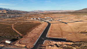View of property location featuring a mountainous background and rural landscape