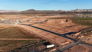 Aerial view of property and surrounding area with mountains and rural landscape