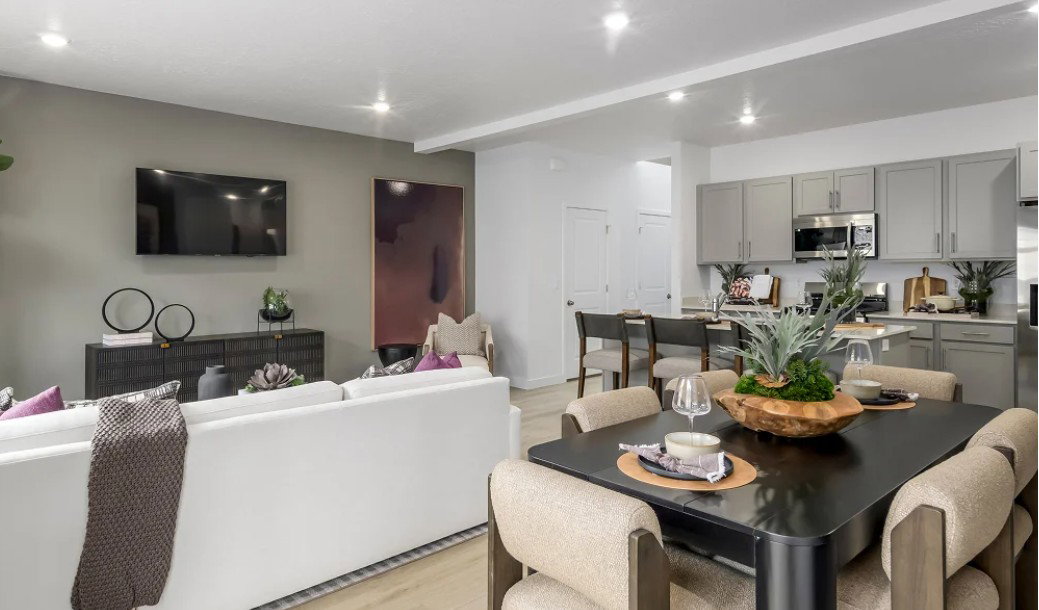 Dining space featuring light wood finished floors, beam ceiling, and recessed lighting