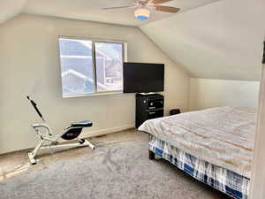 Bedroom featuring carpet flooring, a ceiling fan, and a textured ceiling