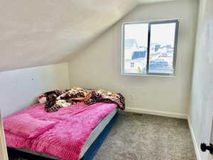 Carpeted bedroom with baseboards