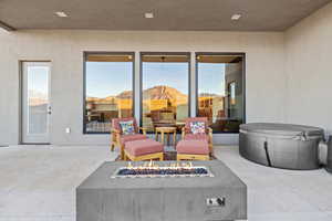 View of patio with a fire pit