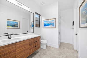 Full bath with vanity and a shower