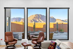 Living area featuring a mountain view and wood finished floors