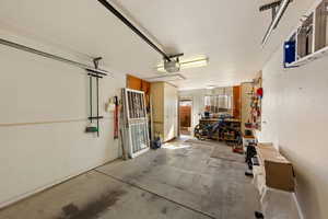 Garage featuring a garage door opener