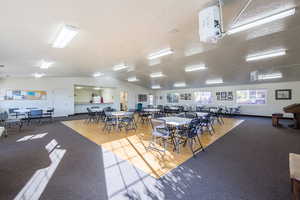 Dining area featuring light colored carpet