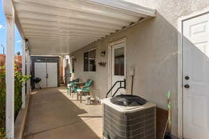 View of patio / terrace with a grill and a storage unit