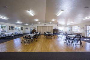 Dining area featuring a textured ceiling and wood finished floors