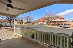 View of patio / terrace with a residential view and a ceiling fan