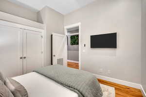 Bedroom featuring a closet and light wood-type flooring