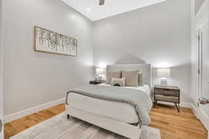 Bedroom with light wood-style floors and ceiling fan