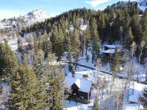 Snowy aerial view with a mountain view