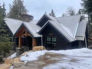 View of front of house with a metal roof