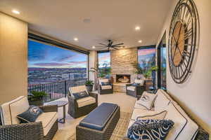 View of patio with outdoor seating and a ceiling fan