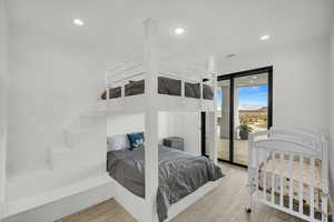 Bedroom featuring recessed lighting, access to outside, and a mountain view
