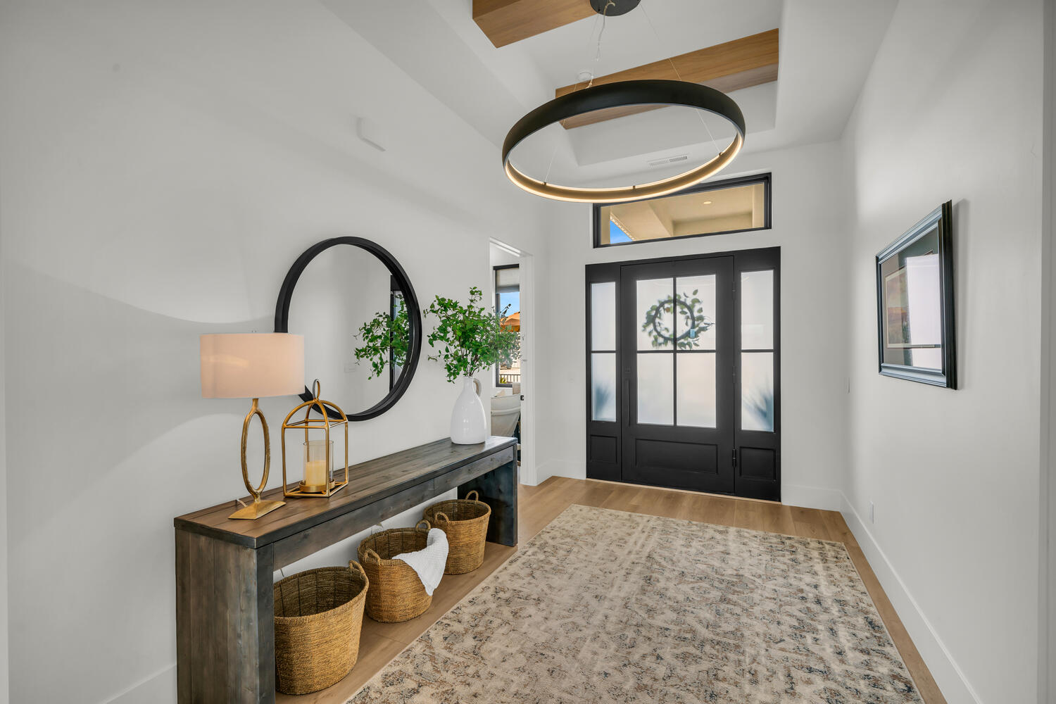 Entrance foyer with wood finished floors and baseboards