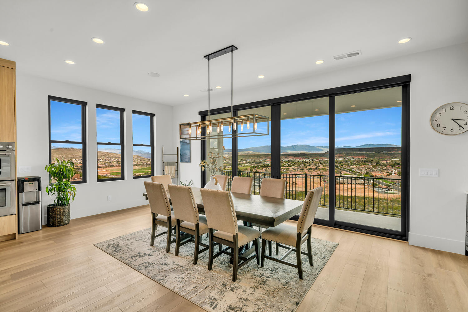 Dining room with a mountain view, light wood-style floors, and recessed lighting