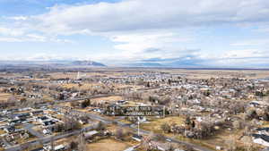 Aerial view of residential area featuring a mountain backdrop