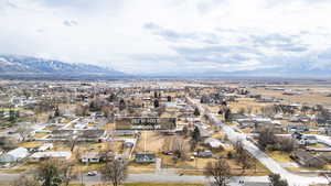 Aerial perspective of suburban area featuring a mountain backdrop