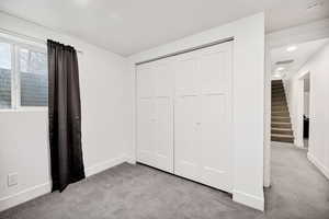 Bedroom with carpet and a closet