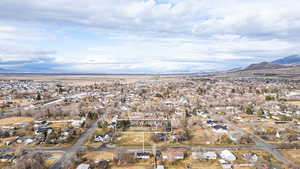 Aerial view of residential area featuring a mountainous background