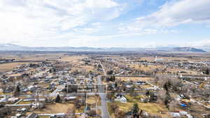 Aerial perspective of suburban area featuring a mountainous background