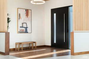 Foyer featuring wood finishes.