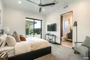 Guest bedroom with access to the pool, a ceiling fan, light carpet, recessed lighting, and ensuite bathroom